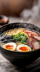 Fototapeta premium Delicious bowl of steaming ramen with soft-boiled eggs and sliced pork