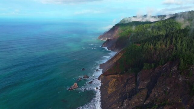 PNW Lost Coast Trail rugged dramatic untouched coastline aerial drone California surf waves boulder rocks USAL Beach campground cloudy shaded mist fog sun rays morning nature landscape circle left