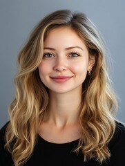 Bright and Cheerful Portrait of a Young Woman with Wavy Hair Smiling at the Camera Against a Soft Gray Background : Generative AI