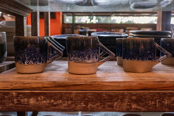 Handmade Ceramic Mug with Unique Design and Geometric Handle