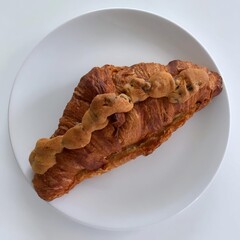 A delicious endless pasta bowl served on a white table, featuring rich flavors, fresh ingredients, and a beautifully crafted presentation, perfect for an indulgent dining experience.