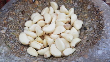Freshly Peeled Garlic Cloves in a Stone Mortar