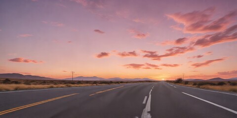 Naklejka premium A scenic highway stretches towards a breathtaking sunset, painted in hues of pink and orange across the vast, tranquil landscape