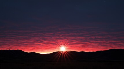 Stunning sunset over mountain range with vibrant colors and serene atmosphere