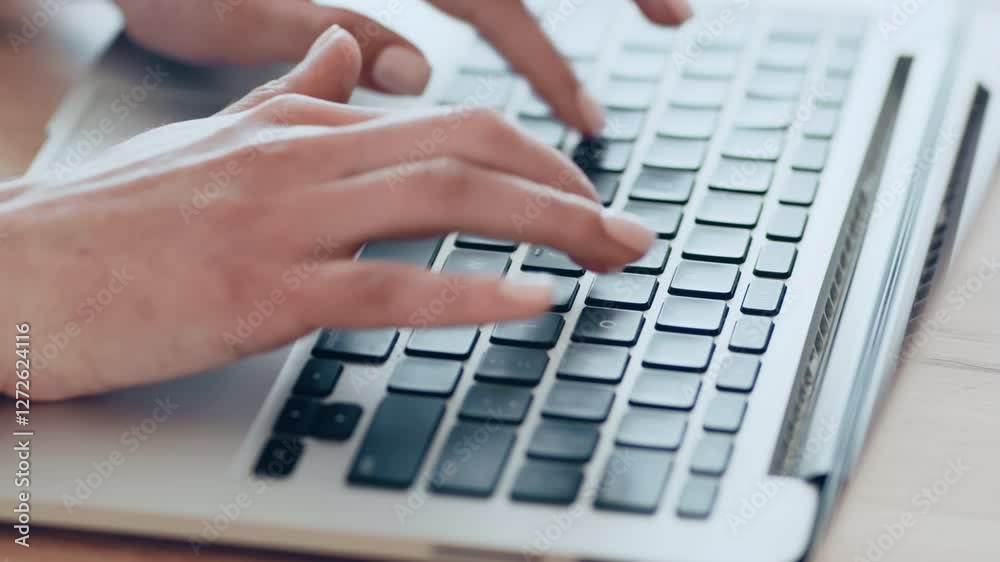 Poster A pair of hands with neatly manicured nails is typing on a laptop keyboard, set against a clean and organized desk. The soft natural light enhances the workspace atmosphere.