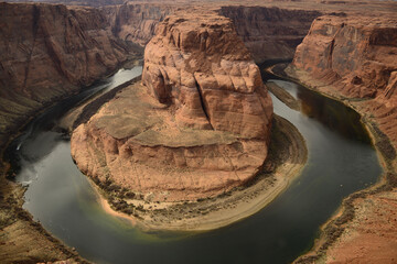 Horseshoe Bend from a high vantage point, showcasing the serene beauty of the Colorado River as it meanders in Arizona tribal lands East Rim of the Grand Canyon
