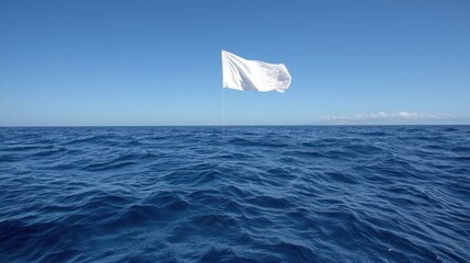White flag waves over ocean; peaceful surrender; clear sky; travel photo