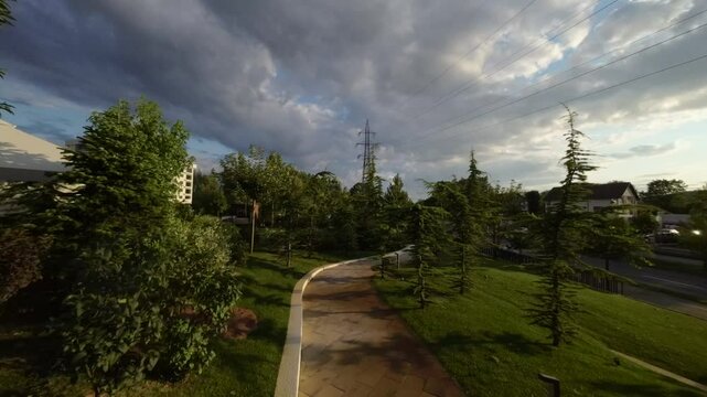 Drone footage of a restaurant garden at sunset in Bulevardul Dem Radulescu, Ramnicu Valcea, Romania