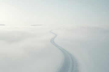 Dementia risk represented by a long, winding road disappearing into the fog. Featuring soft light and hazy tones