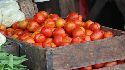 fresh red tomatoes at the traditional market