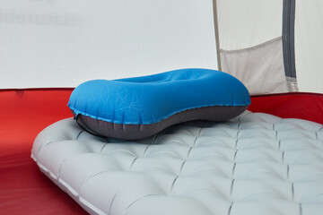 "Camping Cookware Set and Cork Pillow Inside a Tent &ndash; Comfortable Outdoor Setup"