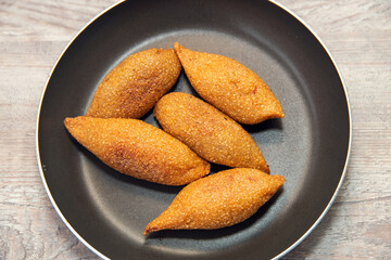 Delicious Lebanese (Arabic) food, (kibe) Kibbeh - The traditional Arabic snack, also known as Quibe. delicious kibbeh,displayed in a frying pan