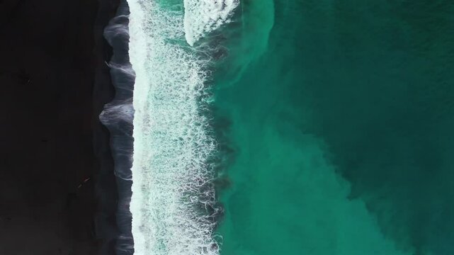 Waves crashing black sand rugged coastline driftwood USAL Beach Campground Lost Coast Trail California Birdseye aerial drone fog mist rain cloudy layers morning Pacific Ocean static shot