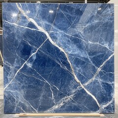 Fototapeta premium Deep Blue Marble with White Veins Displaying Luxurious and Elegant Texture Suitable for Interior Design and Home Renovation Projects in Contemporary Spaces