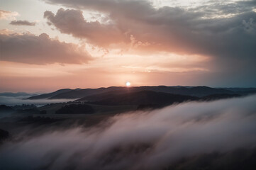 Fototapeta premium Serene Sunrise Over Misty Mountain Ranges – A Dreamy and Peaceful Landscape