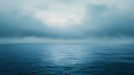 Obraz premium Serene Ocean View with Dramatic Cloudy Sky and Calm Waters