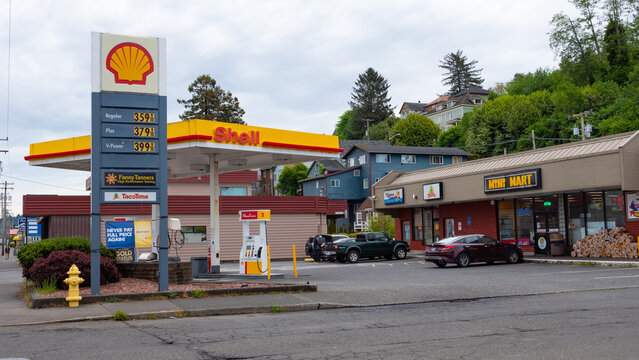 Astoria, Oregon, USA - May 21, 2019: Shell gas station. Gas station of Shell. Petrol station Shell company. Fuel and gasoline. Shell fuel station with cars and Mini mart