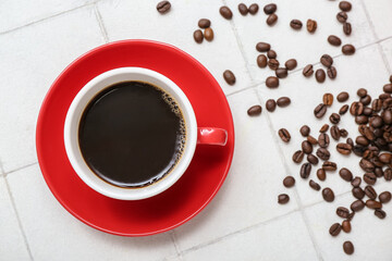 Cup of hot espresso on white tile background