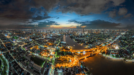 Obraz premium Aerial view of skyscrapers over the financial and tourist district of Bangkok city, along the Chao Phraya River. City skyline, Bangkok, Thailand.
