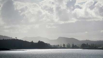 Tahiti misty coastline silhouette with moody lighting  