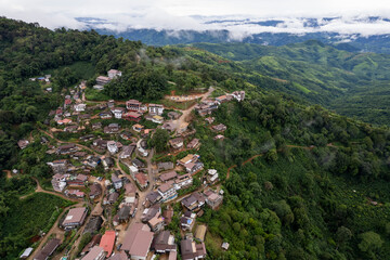 Landscape of Morning Mist with Mountain Layer at north of Thailand. mountain ridge and clouds in rural jungle bush forest