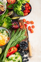 Table full with organic vegetables for making salad.