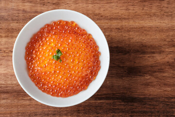 Salmon Roe (Ikura) in a White Bowl.