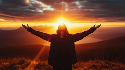 Fototapeta premium Person standing in field with arms outstretched backlit portrait of happy smiling woman