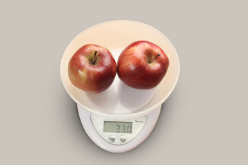 red apples on a scale. Apple kilogram