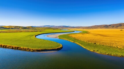 Winding river flows through a vibrant green and yellow landscape