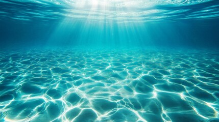 Fototapeta premium Tranquil underwater scene with sunlight and rippling blue ocean water