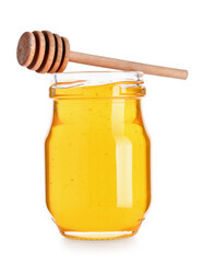 Jar of tasty honey and wooden dipper isolated on white background