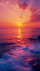 Obraz premium Beautiful Sunset Over Calm Ocean Highlighting Waves and Warm Colors