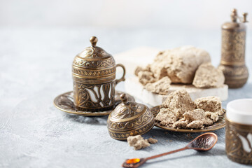 Greek (Turkish) brewed coffee and  halva on a table. Oriental sweetness