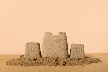 Beautiful sand castle on colorful background © Pixel-Shot