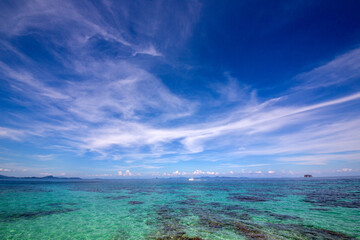 Bright sea water and the beautiful blue sky of the Thai Sea