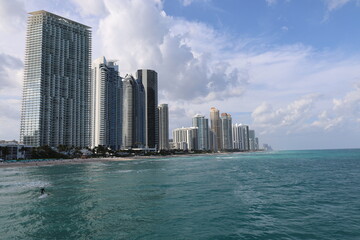 Modern skyscrapers on sunny island beach