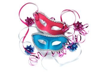 Different beautiful carnival masks and serpentine on white background