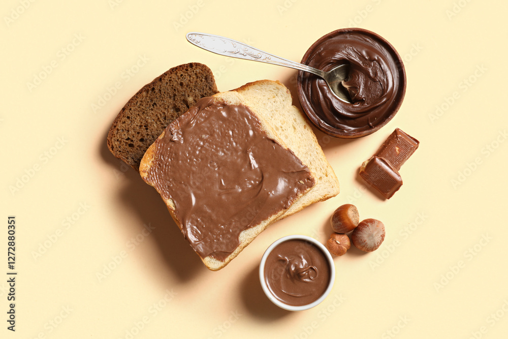 Poster Toasts with sweet chocolate spread and hazelnuts on orange background