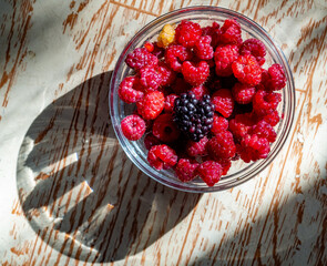 raspberries in a glass bowl