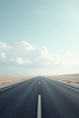 Fototapeta premium A long, straight highway vanishes into the distance under a pale sky, promising adventure and the open road ahead