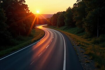 A Winding Asphalt Road at Sunset, Bathed in Golden Light, Curves Through Lush Green Foliage, Offering a Scenic Journey into the Evening