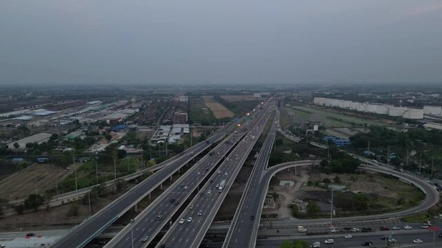 Hyperlapse drone footage of the Rangsit - Nakhon Nayok Road during a cloudy daytime, Thailand