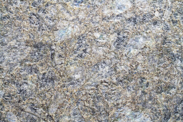 Texture of natural stone close-up. Natural unpolished granite.
