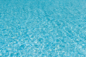 Sea background. Swimming pool rippled. Summer vacation. Spa resort on summer vacation. Pool side resort with pool water surface background. Sea ripples on blue pool background. Luxury retreat