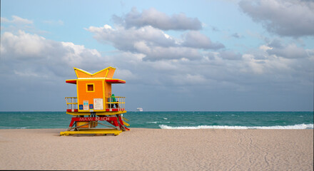 Lifeguard on beach in Miami. Travel and sea resort. Lifeguard station at beach. Lifeguard tower at...