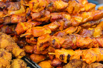 Barbecue grill. Grilled poultry kebab. Delicious shish kebab. Grilled BBQ. Skewer meat cooking on barbecue, rotisserie shashlik. Chicken meat on skewer. Chicken on BBQ grill. Street food
