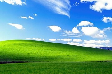 Fototapeta premium Green hills of rolling farmland under a brilliant blue sky with scattered clouds, countryside, nature, cloudless sky