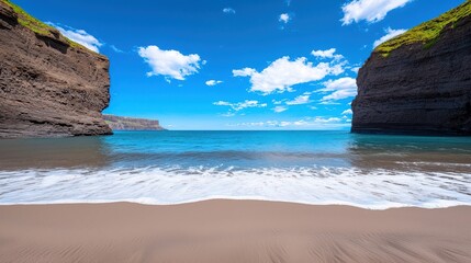 A scenic coastal view of cliffs waves and blue sky