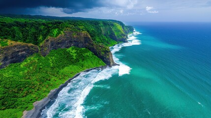 Lush green cliffs meet the turquoise ocean in hawaii